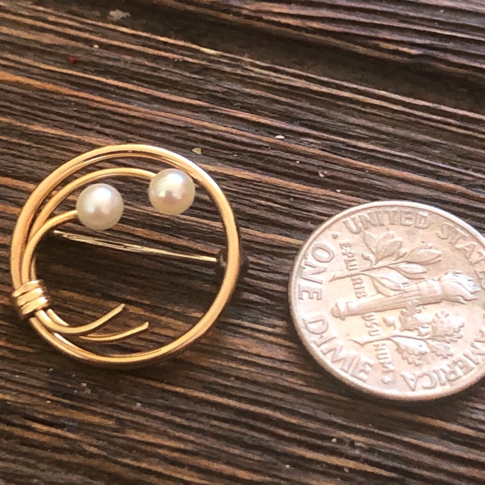Gold and pearl pin by Krementz Jewelers